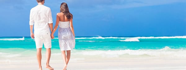 Couple walking on the beach in the Caribbean