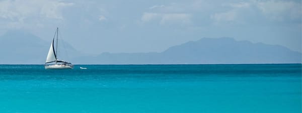Yacht on the horizon on the Caribbean Sea
