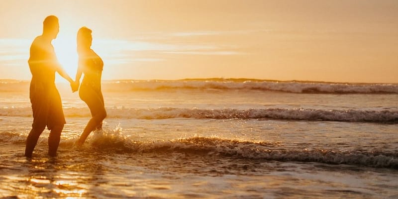 Couple on the beach at sunset