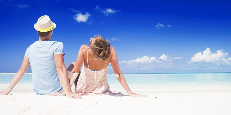 Couple relaxing on a Caribbean beach