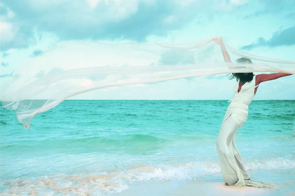 Donna Karan on the beach at Parrot Cay by COMO, Turks & Caicos, image courtesy of Donna Karan International